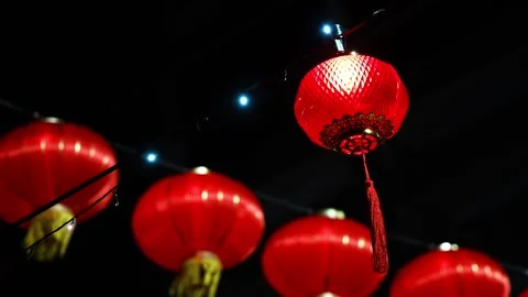 A red lantern is lit up in the dark 스톡 동영상 325840363