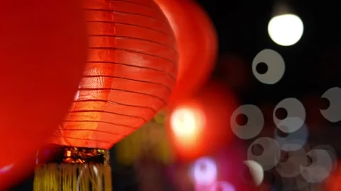 A red lantern is lit up. There are other lanterns in the background 動画素材 325840397