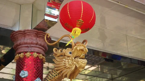Red Lantern Swinging In Front Of A Dragon Statue Stock Footage 34626308