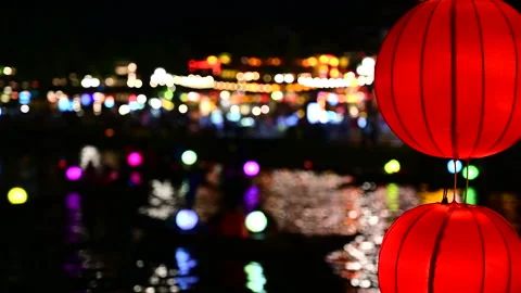 Red Lanterns and Floating Boat Lights Create a Stunning Water Reflection Video stock 296245076
