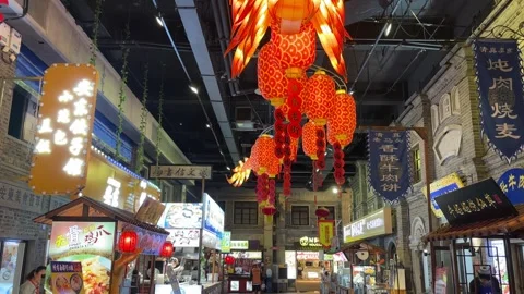 Red Lanterns Hang Above an Indoor Food Market in Dandong China Stock Footage 340176023