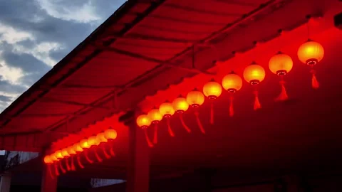 Red Lanterns Hanging at Dusk Stock Footage 328609763