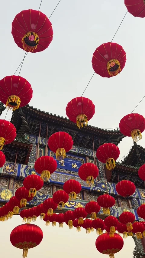 Red lanterns hanging at Temple of Earth during Ditan Temple Fair Stock Footage 329903149