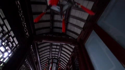 Red Lanterns Hanging Under Traditional Chinese Wooden Ceiling Stock Footage 336678449