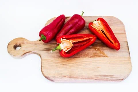 Red large pepper, pepper cut on a white background Stock Photos