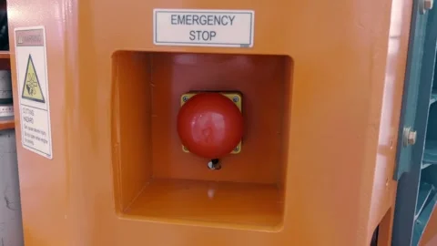Red large round emergency stop buttons on industrial equipment Stock Footage 330901876