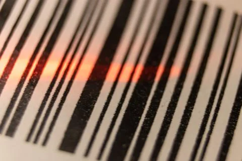 Red laser barcode reader scanning a bar code. Macro bar code. Foto stock