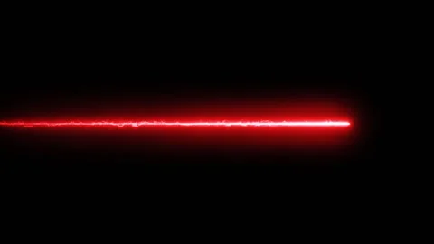 Red laser beam with energetic charges flying one way repeatedly Stock Footage 258686750