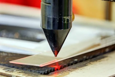 Red laser on cutting machine Stock Photos