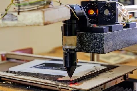 Red laser on cutting machine Stock Photos