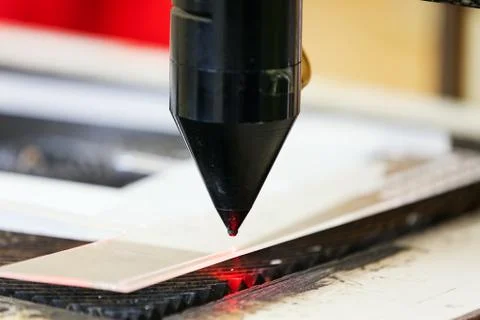 Red laser on cutting machine Stock Photos