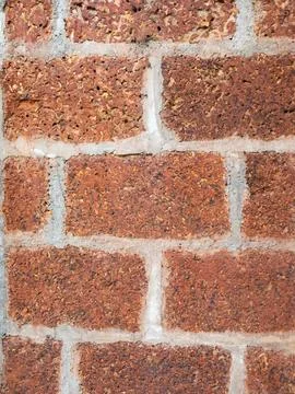 Red laterite stone brick wall texture with white mortar joints, natural roc.. Stock-Fotos