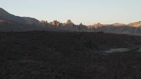 Red lava rock formations in the Teide volcano Park, Tenerife, Spain, magic hour  Stock-Footage 248637558