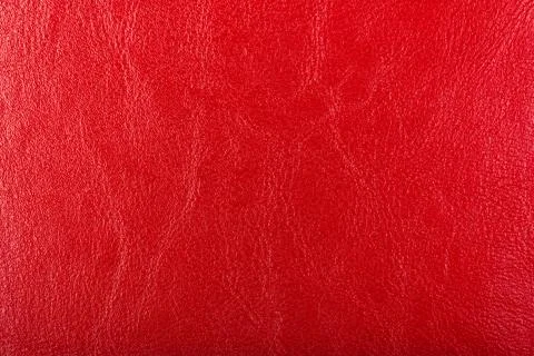 Red Leather Background. Red leather texture closeup background. Structured Stock Photos