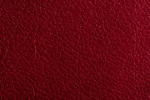 Red leather, closeup view of material texture Stock Photos
