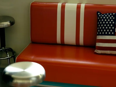 Red leather couch in modern restaurant Stock Footage 76324322