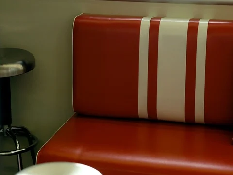 Red leather couch in modern restaurant Stock Footage 76325934