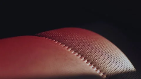 Red leather interior of a car, close-up of a leather interior of a car 库存影片 330767076