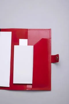 Red leather notebook with white paper and pen holder Stock Photos