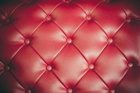 Red leather sofa backrest. Stock Photos