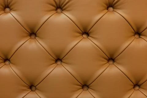 Red leather sofa stitched buttons. Stock Photos