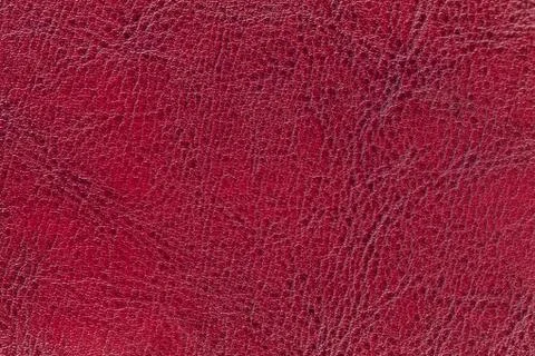 Red leather texture background, closeup. Ruby cracked backdrop from wrinkle s Stock Photos
