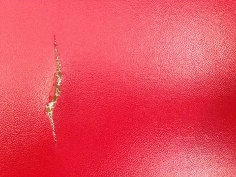 Red leather textured for background Stock Photos