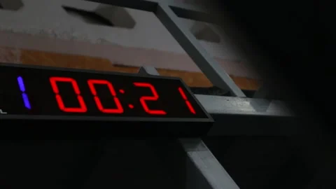 Red led digital timer counting in a  crossfit gym. Sport stopwatch countdown. Stock Footage 141019254