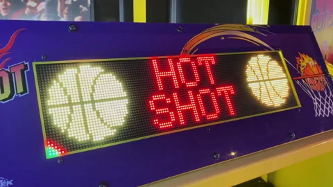 Red LED dot matrix display board showing Hot Shot text on a basketball a dave-15 Stock Footage 339492870