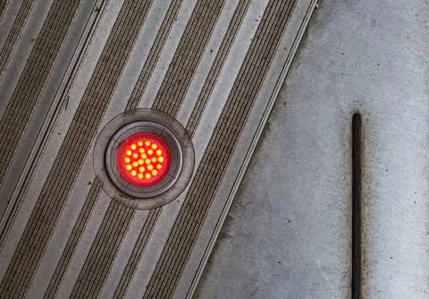 Red LED lights built in to steel floor background Stock Photos