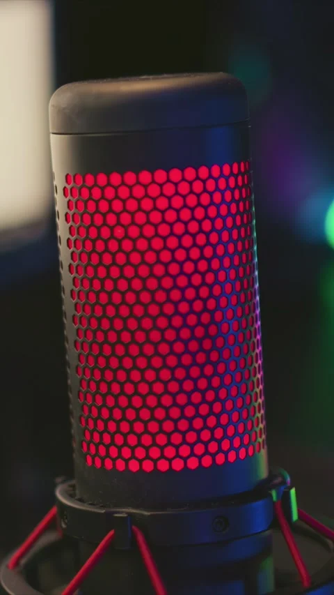 Red LED Microphone Close Up with Hexagonal Grille and Rotational Movement with Stock Footage 345977552