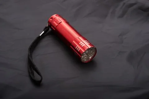 Red LED torch on a black background Stock Photos