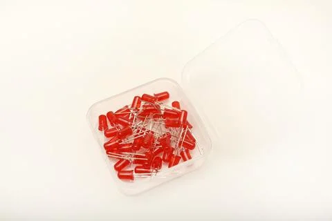 Red LEDs in a plastic box. Semiconductor diodes. Stock Photos