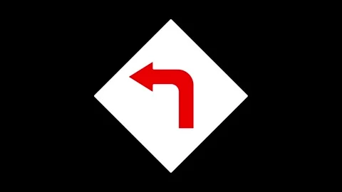 Red left arrow traffic sign on black background. Stockbeeldmateriaal 297951703