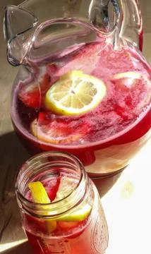 Red Lemonade in a Glass Pitcher 2 Stock Photos