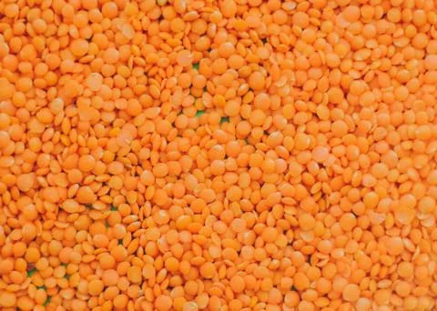 Red lentil background, texture Stock Photos