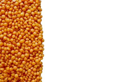 Red lentil is lined with white copyspace isolated on white background Stock Photos
