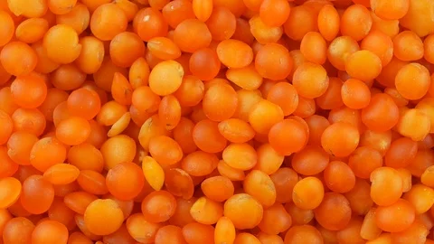 Red lentils background close up Stock Footage 102784472
