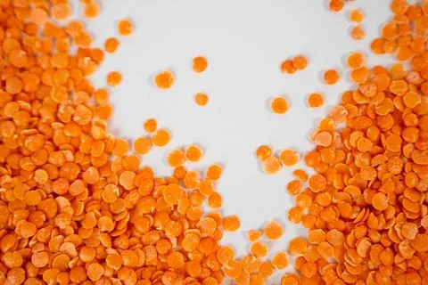 Red Lentils Close-Up on White Background Stock Photos