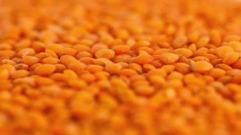 Red lentils forming a background pattern, healthy food Stock Photos