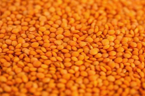 Red lentils forming a background pattern, healthy food Stock Photos