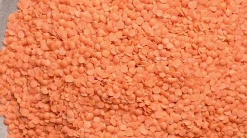 Red Lentils Rotating Background Texture, top view Seamless Food Pattern Stock-Footage 328388672