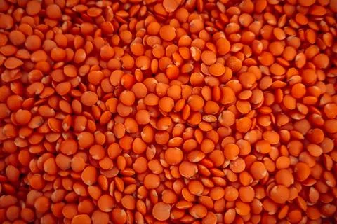 Red Lentils Texture Background Macro Close Up for Healthy Food Ingredient Foto stock