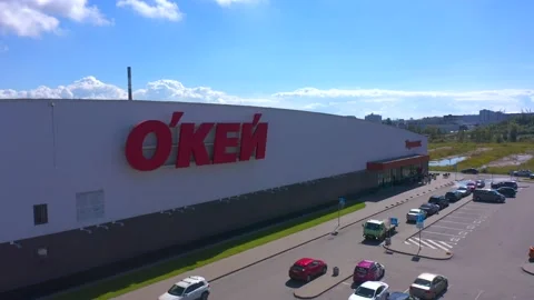 Red letters of the OK logo. Drone flight on a sunny summer day Video stock 137558079