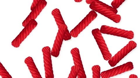 Red Licorice Candy Falling Against a Plain White Background Stock Footage 344836427