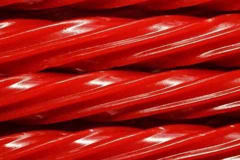 Red Licorice Rope Macro Candy Texture Background Stock-Fotos