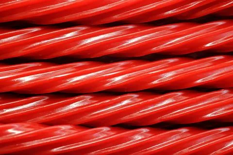 Red Licorice Rope Macro Candy Texture Background Stock-Fotos