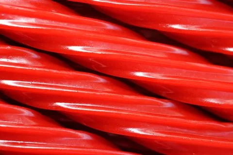 Red Licorice Rope Macro Candy Texture Background Stock-Fotos