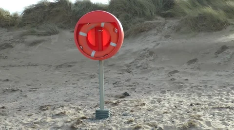 Red life belt on beach Stock Footage 47092704