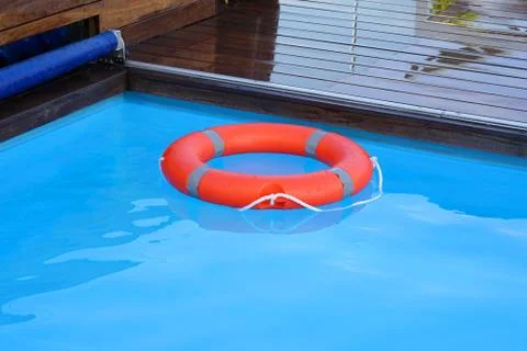 Red lifebuoy pool ring float Stock Photos